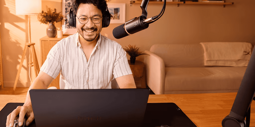 Man using HP laptop and sound equipment